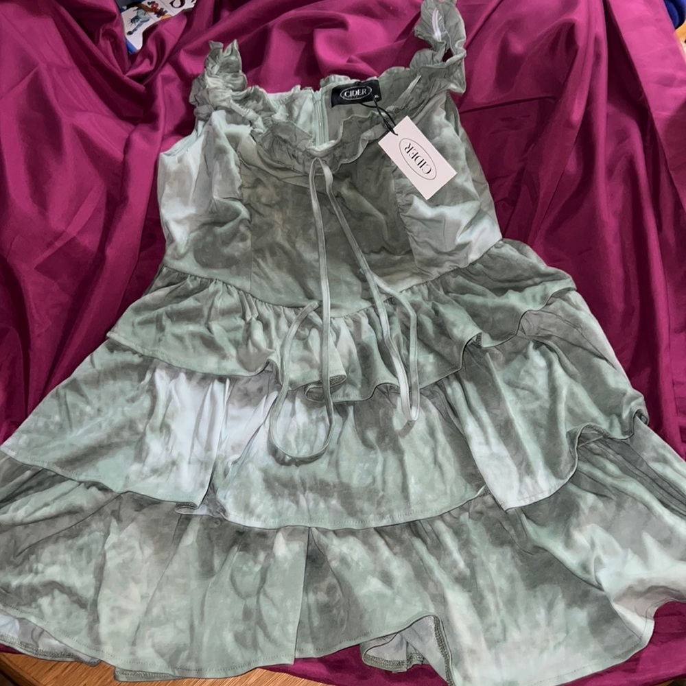 Green/white washed ruffled dress. scrunched straps. runs a little small.